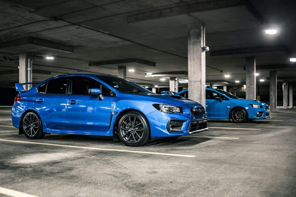 blue subaru cars in parking